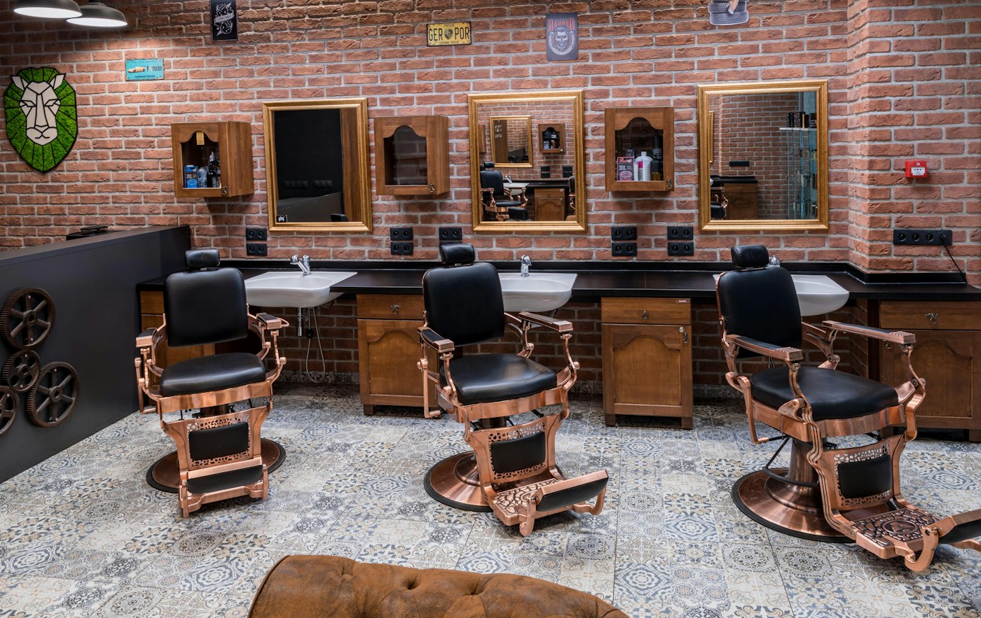 A barbershop with a row of chairs ready for the day